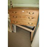 A PINE THREE DRAWER BOX CHEST together with an associated four legged stand