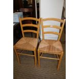A PAIR OF MODERN LADDER BACK RUSH SEATED CHAIRS
