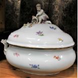 A LARGE SIZED CONTINENTAL PORCELAIN LIDDED TUREEN with moulded putti handle, and floral