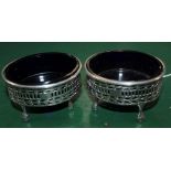 TWO HALLMARKED VICTORIAN SILVER SALTS with blue glass liners