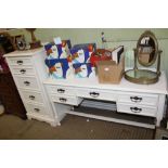 A TWO PIECE WHITE PAINTED BEDROOM SUITE comprising tall five drawer chest and a knee hole dressing