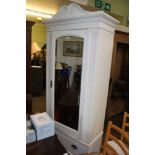 A LATER PAINTED EARLY 20TH CENTURY MAHOGANY SINGLE DOOR WARDROBE with bevelled mirror panel over