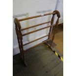 A STANDARD BEECH FIVE BAR TOWEL RAIL