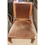 A LATE 19TH / EARLY 20TH CENTURY WALNUT FRAMED NURSING STYLE CHAIR with velour upholstered back