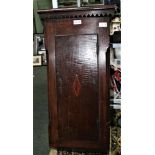 A SLENDER OAK HANGING CUPBOARD