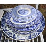 A LARGE BLUE & WHITE DELFT CHARGER together with a selection of blue & white transfer decorated