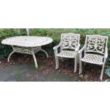 A STONE EFFECT GARDEN TABLE WITH SIX CHAIRS