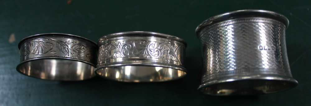 THREE HALLMARKED NAPKIN RINGS together with a silver scalloped bowl, tea caddy spoon - Image 3 of 3