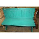 A LATER PAINTED SOFTWOOD BENCH SETTLE, having lift-up seat for storage access