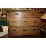 A 19TH CENTURY CONTINENTAL DESIGN PINE FOUR DRAWER CHEST with decorative sides and squashed bun feet