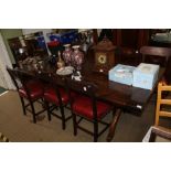 A REPRODUCTION OAK RECTANGULAR TOPPED REFRECTORY STYLE TABLE, supported on double 'X' shaped