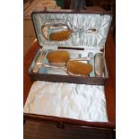 A CASED SILVER DRESSING TABLE SET