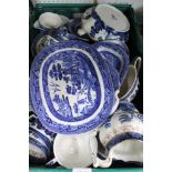 A CRATE CONTAINING A LARGE SELECTION OF BLUE & WHITE TRANSFER DECORATED TABLE WARES the majority