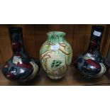 A PAIR OF LARGE DECORO BOTTLE VASES, together with a rustic terracotta jug, decorated with a