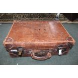 A SMALL SIZED BROWN LEATHER SUITCASE