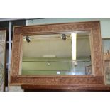 A LARGE FANCY CARVED WOODEN FRAMED RECTANGULAR PLAIN PLATE WALL MIRROR