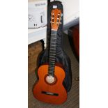 A SOFT CASED TRADITIONAL SPANISH STYLE GUITAR