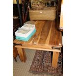 A LARGE SIZED IMPORTED HARD WOOD RECTANGULAR TOPPED COFFEE TABLE on block legs