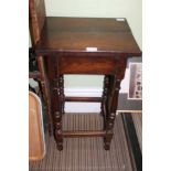 AN OAK SQUARE TOPPED LAMP TABLE on slender turned and block legs