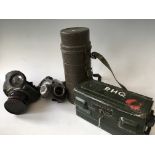 A collection of military items to include gas mask filter carrier, two gas masks and portable