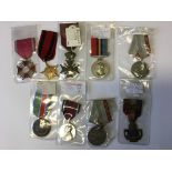 A group of nine various medals to include U.N. Peace medal, polish and Russian medals etc.