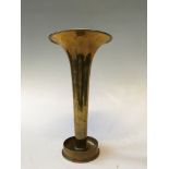 A brass shell 1917 trench art trumpet form vase with floral engraving.