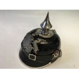 A German leather Pickelhaube with chrome spike and trim.