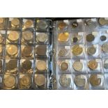 A folder containing a large collection of various coins to include English coins.