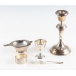 A collection of hallmarked silverware, to include a weighted silver candle stick, hallmarked