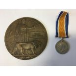 A First World War death plaque in brown package and War medal awarded to William John Crease,