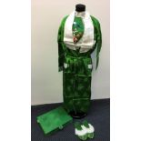 A green silk kimono to include shirt with embroidered mountain, pagoda and flower scene, robe,