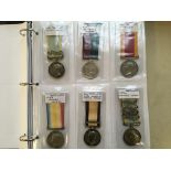 A folder of replica medals to include Crimea medals, Waterloo medals etc. 28 medals in total.
