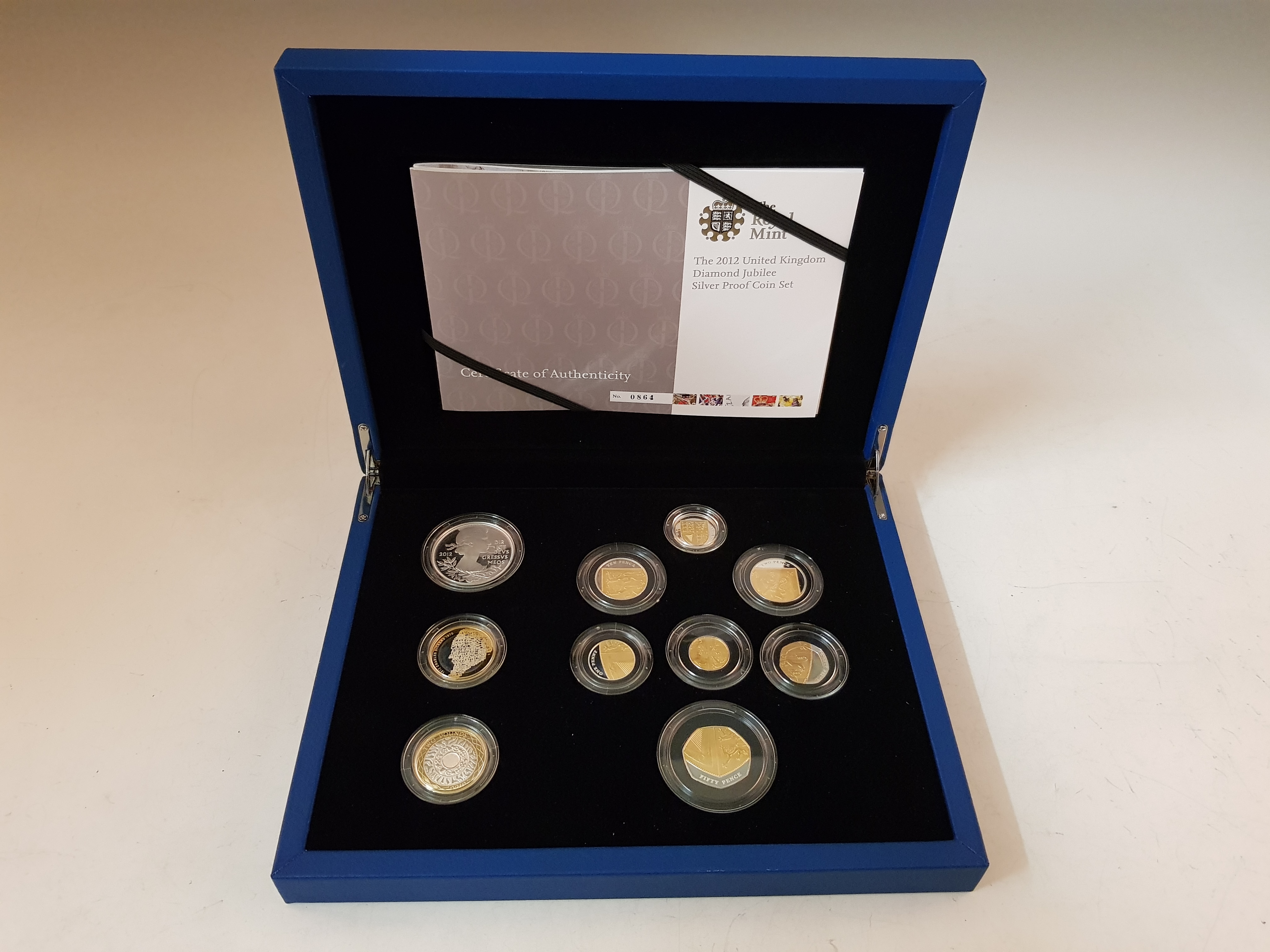 A Royal Mint 2012 Diamond Jubilee silver proof coin set of 10 coins in box.