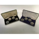 Two four-coin sets of Overton Farrell & Sons Ltd silver medals with train and locomotive design.