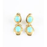 A pair of reconstituted turquoise stud drop earrings, each set with two reconstituted turquoise