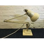 A cream Anglepoise lamp.