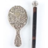 A silver hand mirror, featuring repousse green man, foliage and bird design, hallmarked Chester