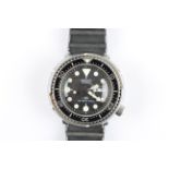 A gents Seiko Quartz Divers 300m wrist watch, the black dial having hourly dot markers with minute