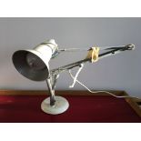 A white Anglepoise lamp.