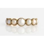 A 19th Century split pearl ring, set with seven graduated split pearls, unmarked yellow metal,