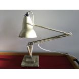 A white Anglepoise lamp.