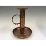 An Arts and Craft copper candlestick holder, height 25cm.