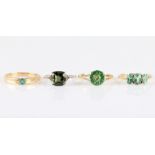 Four hallmarked 9ct gold green gemstone set rings, to include a fancy cut green quartz, a three