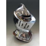 A reproduction knights helmet with fin top.