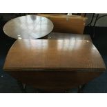 An oak tilt topped pedestal table with two oak blanket boxes, two chairs and drop leaf table.