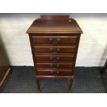 A mahogany Edwardian five drawer music chest.