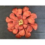 Two decorative metalwork wall hangings, a red and yellow flower, diameter 80cm, with a bridge over