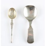 A Georgian caddy spoon, stamped with lion passant rest of hallmark rubbed, together with a