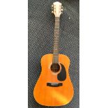 A Harmony H6830 acoustic guitar.