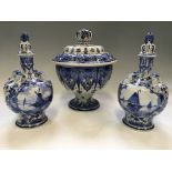 Delftware to include two lidded vases, with windmill and boat scenes, heights 25cm, together with